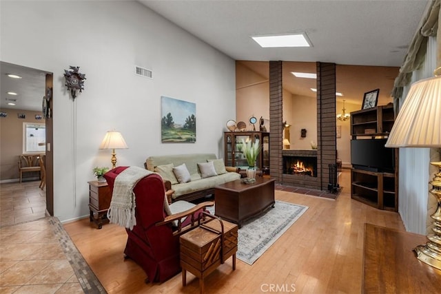20121 Swansea Ln, Huntington Beach, CA 92646 - living area with a fireplace, baseboards, high vaulted ceiling, and ornate columns