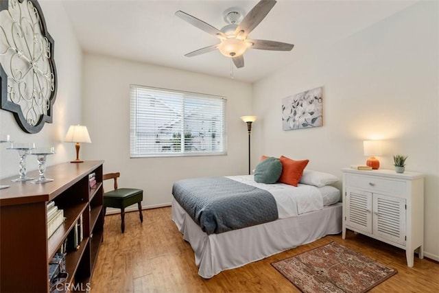 20121 Swansea Ln, Huntington Beach, CA 92646 - bedroom with light wood-style flooring, a ceiling fan, and baseboards