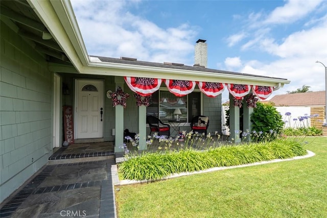 20121 Swansea Ln, Huntington Beach, CA 92646 - doorway to property with a yard and a chimney