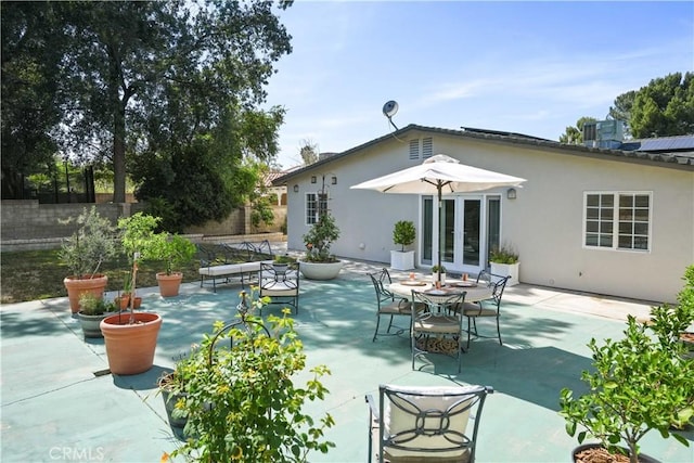 23538 Arlen Dr, Newhall, CA 91321 - back of house with french doors, stucco siding, and a patio area