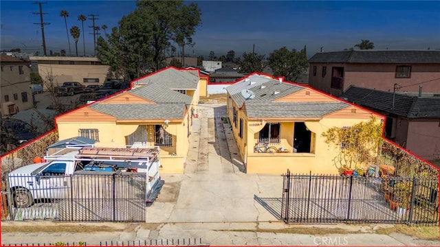 11100 S Normandie Ave, Los Angeles, CA 90044 - view of front of home with a fenced front yard, stucco siding, and concrete driveway