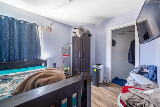 11100 S Normandie Ave, Los Angeles, CA 90044 - bedroom with light wood finished floors