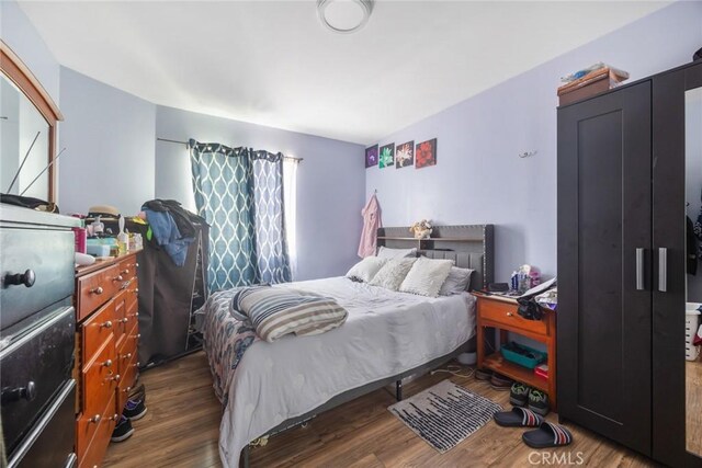 11100 S Normandie Ave, Los Angeles, CA 90044 - bedroom featuring wood finished floors