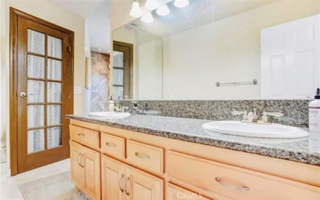564 Northpark Blvd, San Bernardino, CA 92407 - bathroom with double vanity and tile patterned flooring