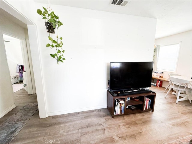 858 Bussey St, San Bernardino, CA 92405 - living room with wood finished floors and baseboards