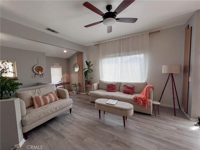 26959 Hillsborough Pkwy, Unit Valencia, CA 91354 - living area with light wood finished floors, a ceiling fan, and baseboards