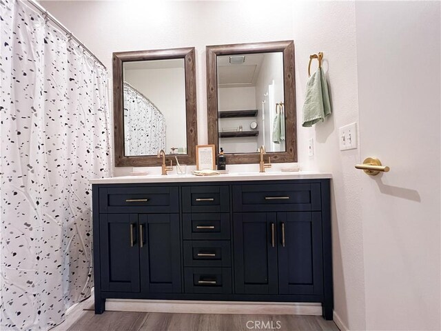 26959 Hillsborough Pkwy, Unit Valencia, CA 91354 - full bath featuring double vanity and wood finished floors