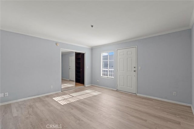 10925 Blix St Unit 309, Toluca Lake, CA 91602 - empty room with ornamental molding, wood finished floors, and baseboards
