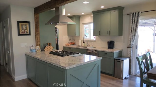 6214 Granby Ave, Rancho Cucamonga, CA 91737 - kitchen featuring island exhaust hood, a sink, tasteful backsplash, wood finished floors, and recessed lighting