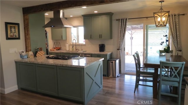 6214 Granby Ave, Rancho Cucamonga, CA 91737 - kitchen with a sink, black gas stovetop, dark wood-style flooring, wall chimney exhaust hood, and a peninsula