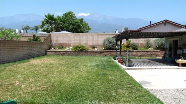6214 Granby Ave, Rancho Cucamonga, CA 91737 - view of yard featuring a mountain view, a patio, a pergola, and central AC unit