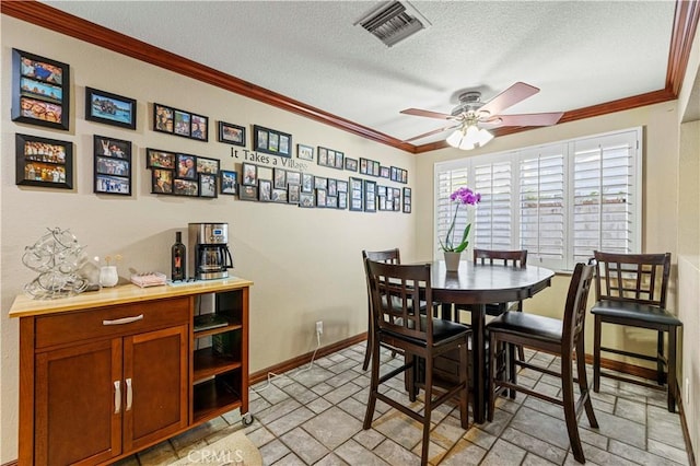 28642 Apricot Pl, Saugus, CA 91390 - dining room with ornamental molding, a textured ceiling, light stone finish floors, a ceiling fan, and baseboards