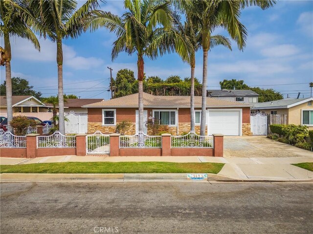 3133 W 187th Pl, Torrance, CA 90504 - single story home featuring stone siding, a fenced front yard, a garage, driveway, and stucco siding