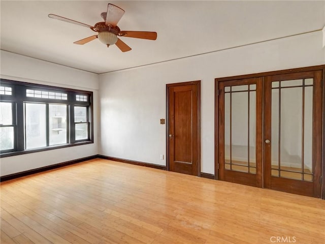 1030 E Ocean Blvd Unit 403, Long Beach, CA 90802 - spare room with french doors, wood finished floors, baseboards, and a ceiling fan