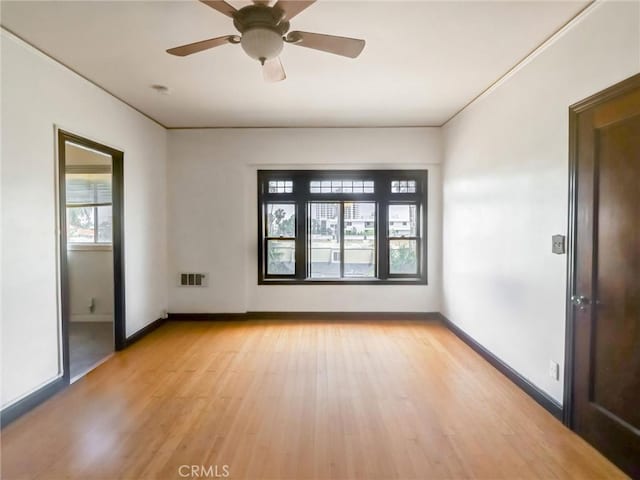 1030 E Ocean Blvd Unit 403, Long Beach, CA 90802 - empty room featuring light wood-style floors, baseboards, and ceiling fan