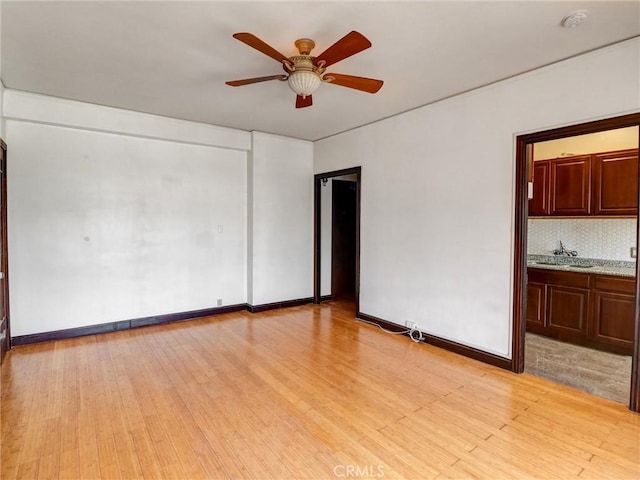 1030 E Ocean Blvd Unit 403, Long Beach, CA 90802 - spare room featuring ceiling fan, light wood-style floors, a smoke detector, and baseboards