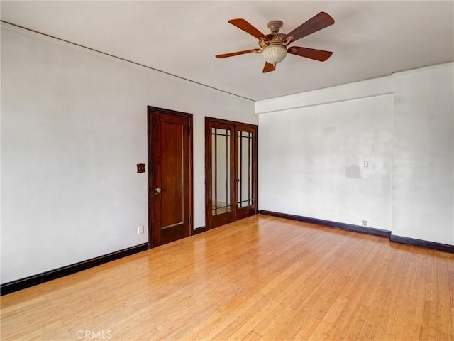 1030 E Ocean Blvd Unit 403, Long Beach, CA 90802 - unfurnished room with a ceiling fan, wood finished floors, and baseboards