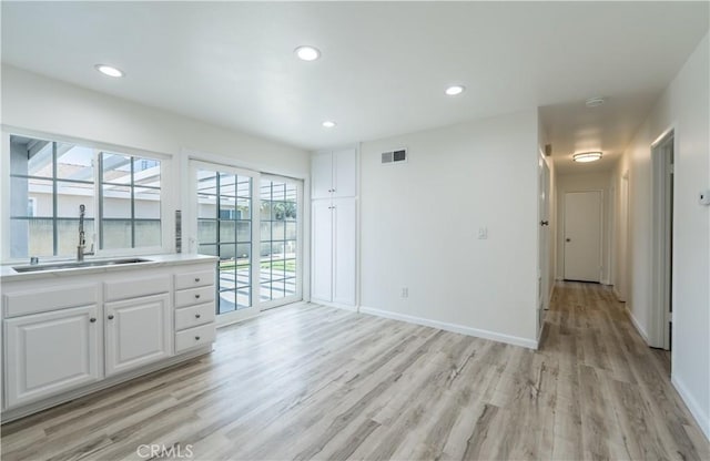 19631 Fagan Way, Cerritos, CA 90703 - empty room featuring a sink, light wood-type flooring, recessed lighting, baseboards, and a smoke detector