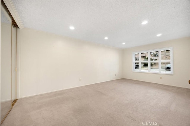 12931 Cuesta Ln, Cerritos, CA 90703 - unfurnished room featuring light carpet, recessed lighting, ornamental molding, and a textured ceiling
