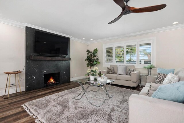 3984 Scott Dr, Carlsbad, CA 92008 - living area featuring wood finished floors, crown molding, ceiling fan, baseboards, and a high end fireplace
