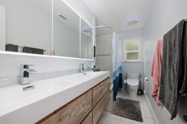 3984 Scott Dr, Carlsbad, CA 92008 - bathroom featuring toilet, double vanity, tile patterned flooring, and a shower with shower curtain
