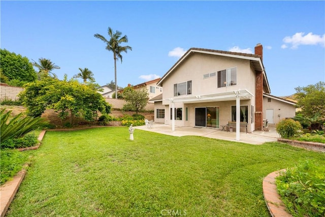 15202 El Selinda Dr, Hacienda Heights, CA 91745 - back of property with a chimney, a patio area, and stucco siding