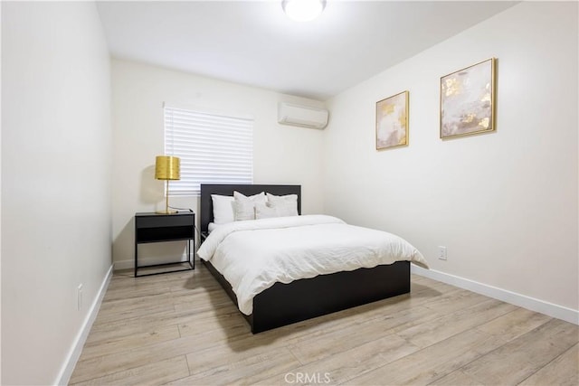 3720 S St Andrews Pl, Los Angeles, CA 90018 - bedroom featuring a wall mounted AC and light wood finished floors