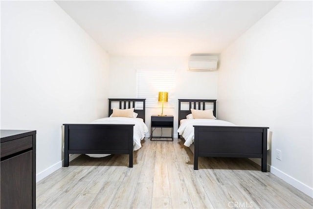 3720 S St Andrews Pl, Los Angeles, CA 90018 - bedroom featuring a wall mounted AC and light wood-type flooring
