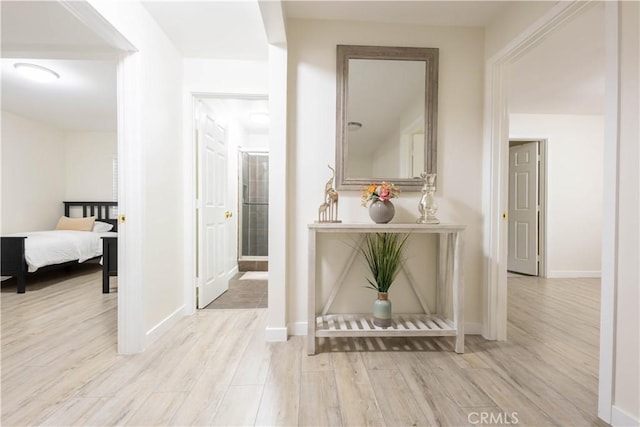 3720 S St Andrews Pl, Los Angeles, CA 90018 - corridor with light wood-style flooring and baseboards