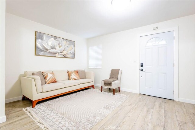 3720 S St Andrews Pl, Los Angeles, CA 90018 - living room featuring light wood-type flooring and baseboards