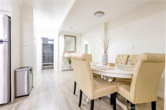 3720 S St Andrews Pl, Los Angeles, CA 90018 - dining room with light wood-style floors and baseboards