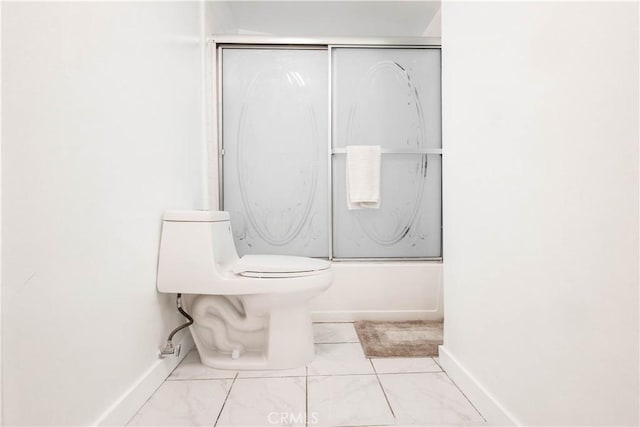 3720 S St Andrews Pl, Los Angeles, CA 90018 - bathroom with marble look tiles and bath / shower combo with glass door