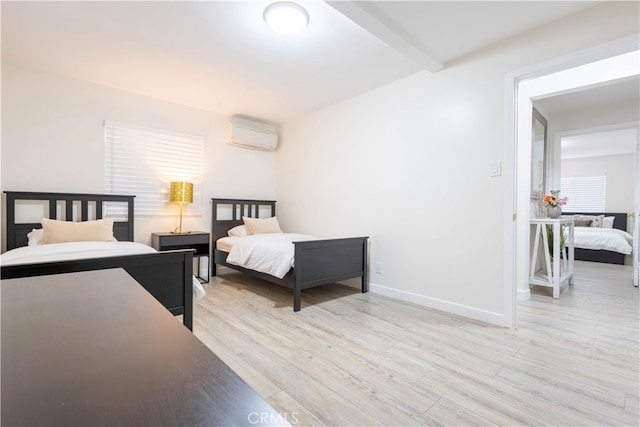 3720 S St Andrews Pl, Los Angeles, CA 90018 - bedroom with light wood finished floors and an AC wall unit