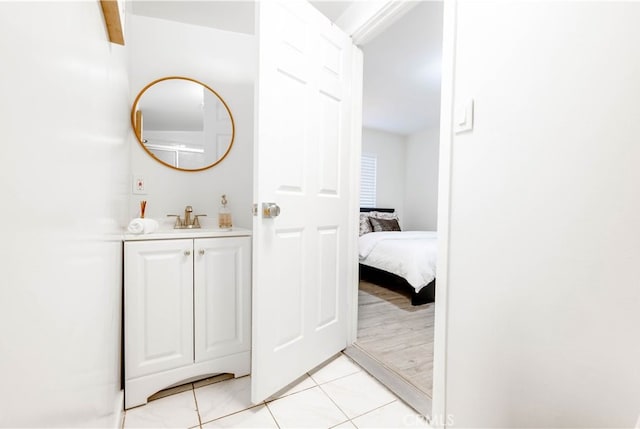 3720 S St Andrews Pl, Los Angeles, CA 90018 - ensuite bathroom featuring vanity and tile patterned flooring