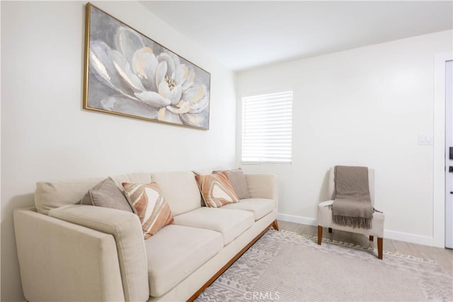 3720 S St Andrews Pl, Los Angeles, CA 90018 - living room featuring baseboards and wood finished floors