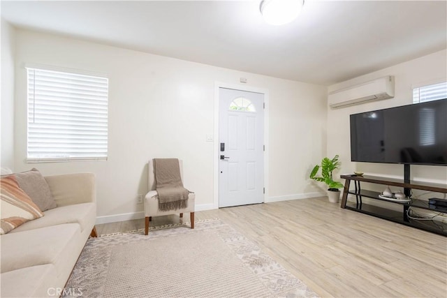 3720 S St Andrews Pl, Los Angeles, CA 90018 - living room with a wall mounted air conditioner and light wood finished floors