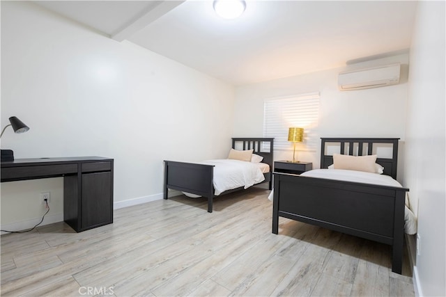 3720 S St Andrews Pl, Los Angeles, CA 90018 - bedroom featuring an AC wall unit and light wood-style floors