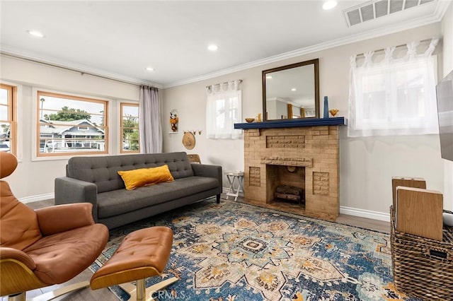 3648 4th Ave, Los Angeles, CA 90018 - living room with healthy amount of natural light, recessed lighting, ornamental molding, a brick fireplace, and wood finished floors