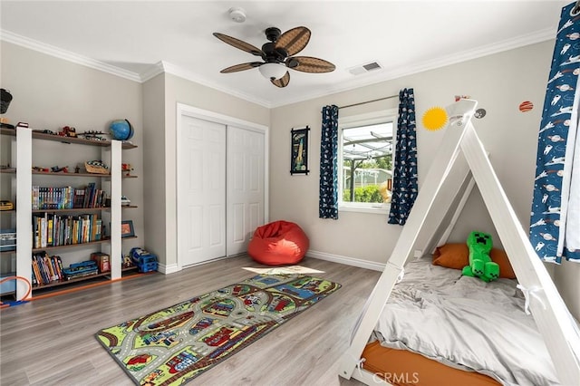 3648 4th Ave, Los Angeles, CA 90018 - bedroom featuring wood finished floors, a closet, ornamental molding, and a ceiling fan