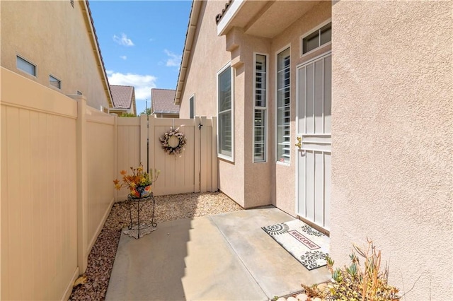 730 Zaphiro Ct, San Jacinto, CA 92583 - entrance to property featuring stucco siding and a patio