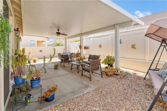 730 Zaphiro Ct, San Jacinto, CA 92583 - fenced backyard with a patio, a ceiling fan, and an outdoor hangout area