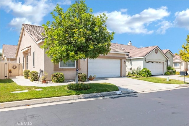 730 Zaphiro Ct, San Jacinto, CA 92583 - view of front of home featuring a tile roof, stucco siding, and a garage
