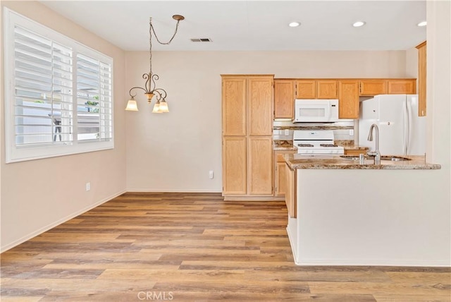 730 Zaphiro Ct, San Jacinto, CA 92583 - kitchen featuring white appliances, light wood finished floors, a sink, light stone counters, and recessed lighting