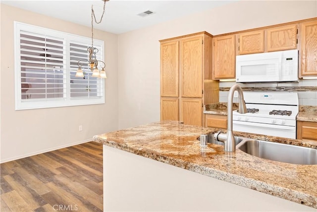 730 Zaphiro Ct, San Jacinto, CA 92583 - kitchen featuring white appliances, a sink, dark wood-type flooring, pendant lighting, and baseboards
