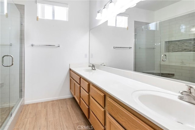 730 Zaphiro Ct, San Jacinto, CA 92583 - full bath with healthy amount of natural light, double vanity, a stall shower, and baseboards