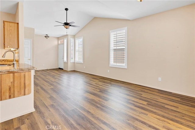730 Zaphiro Ct, San Jacinto, CA 92583 - unfurnished living room featuring a ceiling fan, a sink, wood finished floors, lofted ceiling, and baseboards