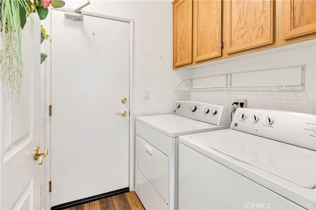 730 Zaphiro Ct, San Jacinto, CA 92583 - laundry area with independent washer and dryer, cabinet space, and dark wood-style floors