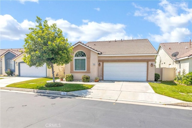 730 Zaphiro Ct, San Jacinto, CA 92583 - view of front of house featuring driveway, a tile roof, stucco siding, and a garage