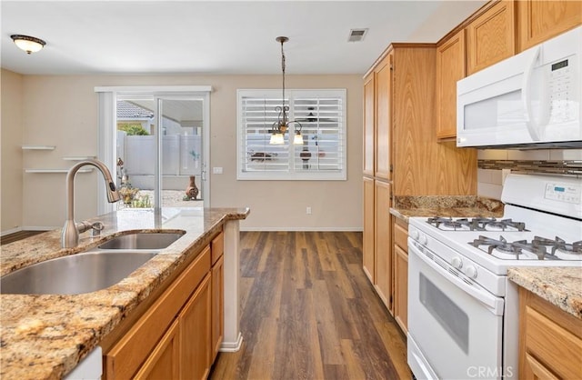 730 Zaphiro Ct, San Jacinto, CA 92583 - kitchen featuring white appliances, a sink, dark wood finished floors, baseboards, and hanging light fixtures