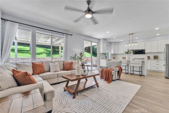 11376 Starlight Dr, Rancho Cucamonga, CA 91701 - living room featuring light wood-style flooring, a ceiling fan, and recessed lighting